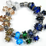 Example showing different colors and variety of shapes of handmade large hole lampwork beads
